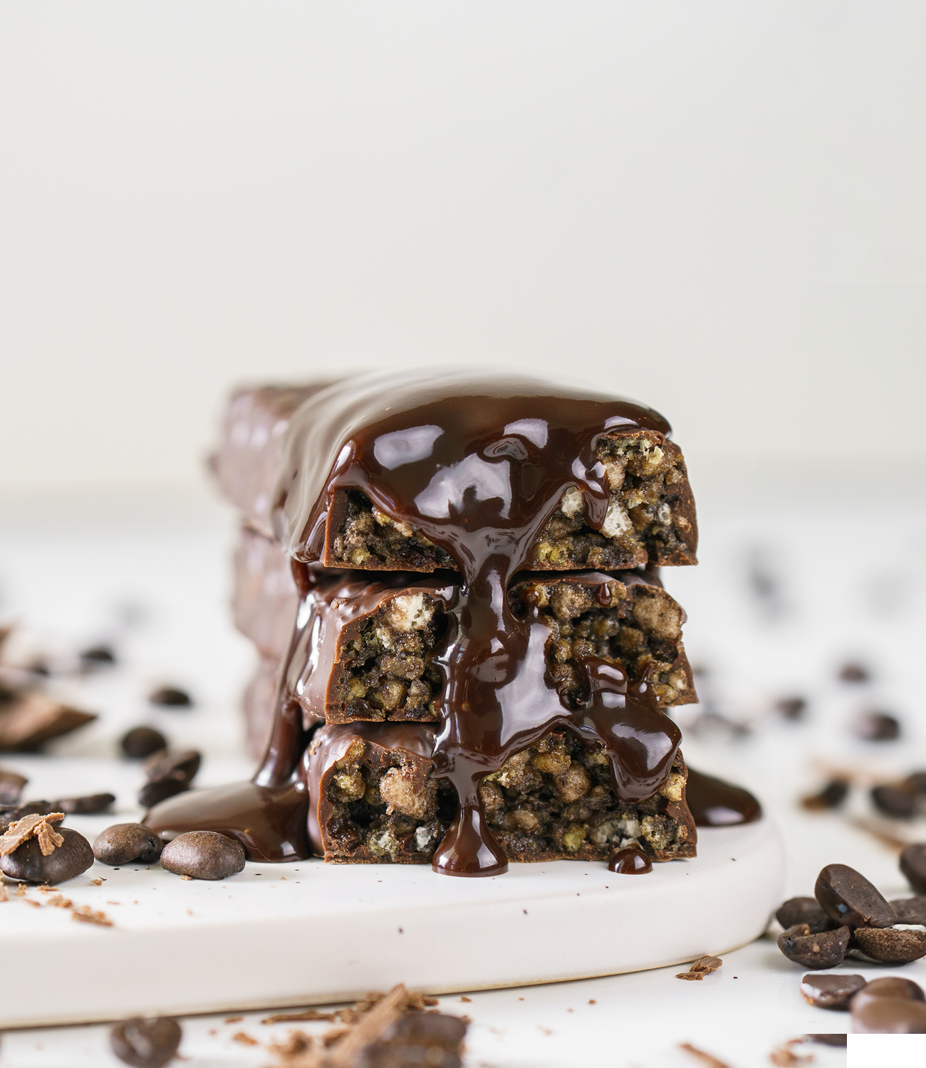 Dark Chocolate Drizzle on Chocolate Protein Bar surrounded by Chocolate Chips