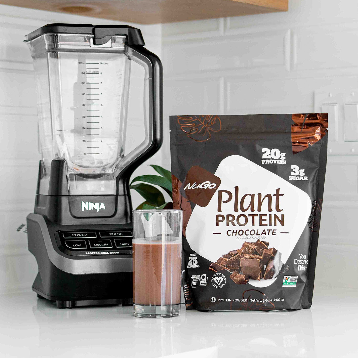 Chocolate Protein Powder next to Blender