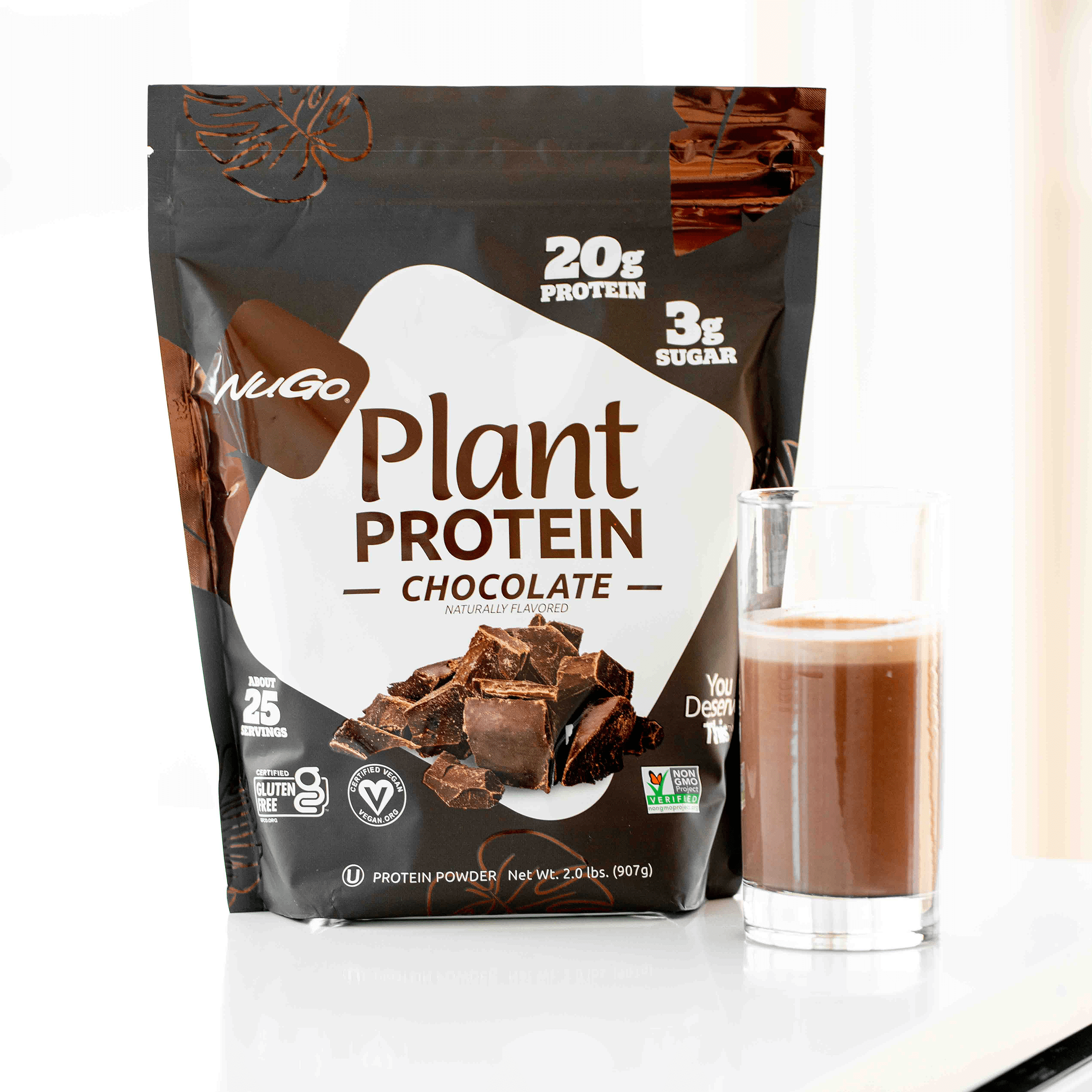Chocolate Protein Powder with product mixed in glass